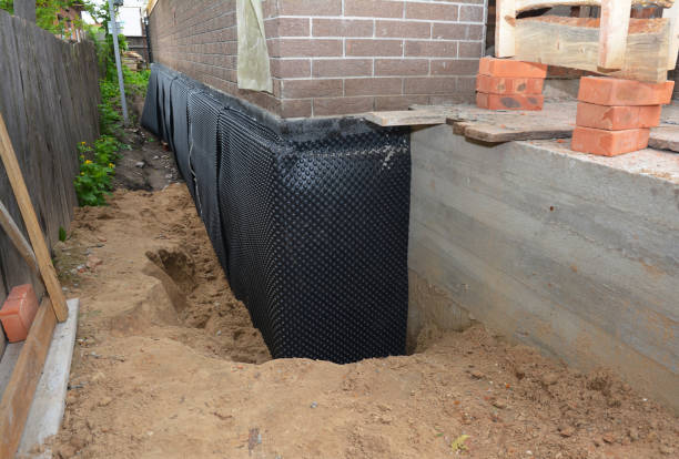 Happy homeowners after waterproofing job in Saint James